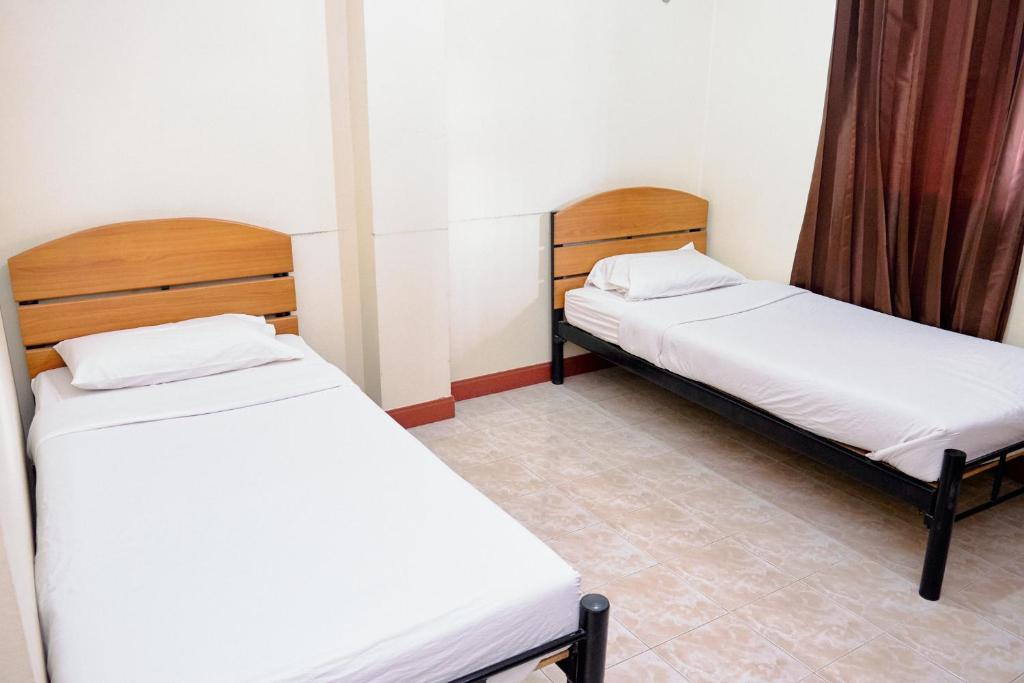 Postel nebo postele na pokoji v ubytování Toon Guesthouse