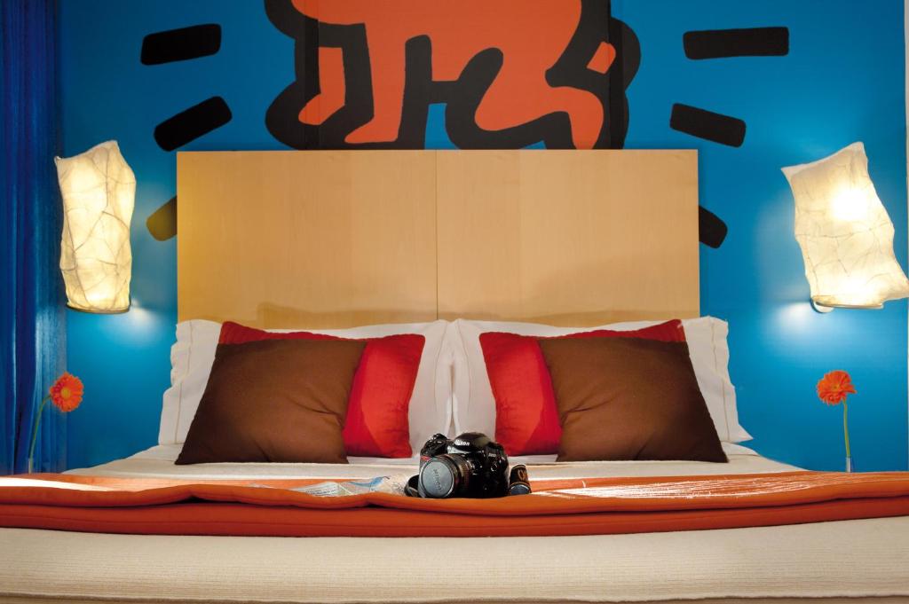 Postel nebo postele na pokoji v ubytování Hotel Abitart
