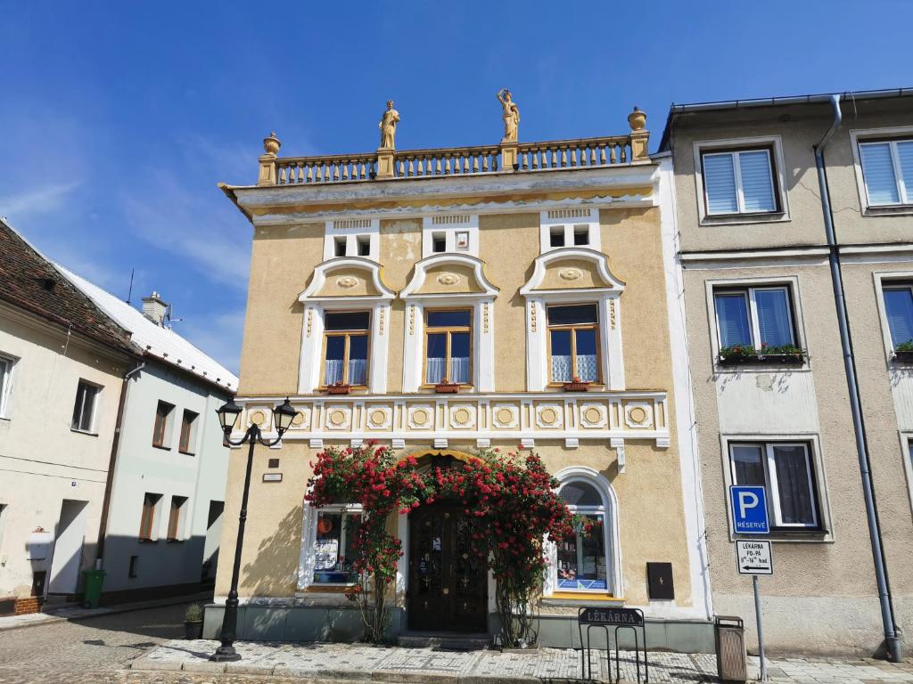 a building with flowers on the front of it at U Černého orla in Vidnava