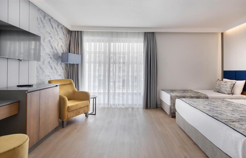 Postel nebo postele na pokoji v ubytování Sealife Kemer Resort Hotel - Ultra All Inclusive