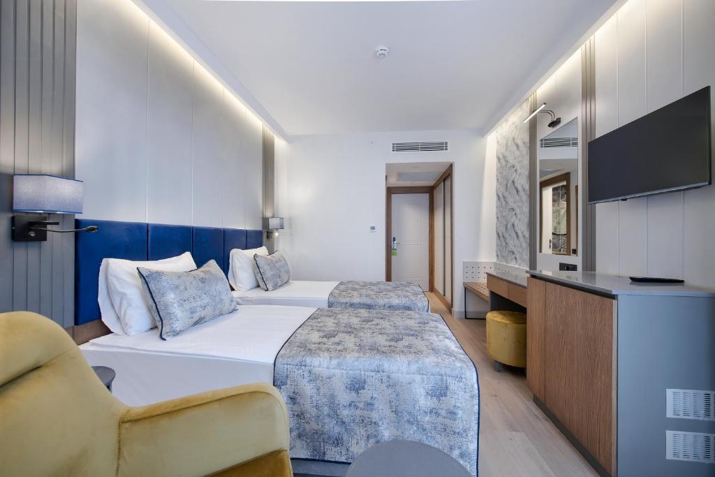 Postel nebo postele na pokoji v ubytování Sealife Kemer Resort Hotel - Ultra All Inclusive