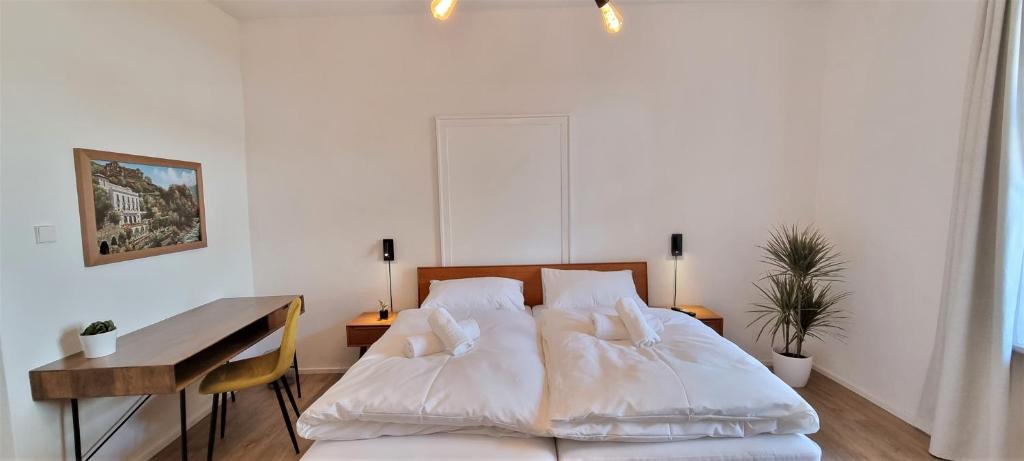 Postel nebo postele na pokoji v ubytování Rosa Rooms Meran