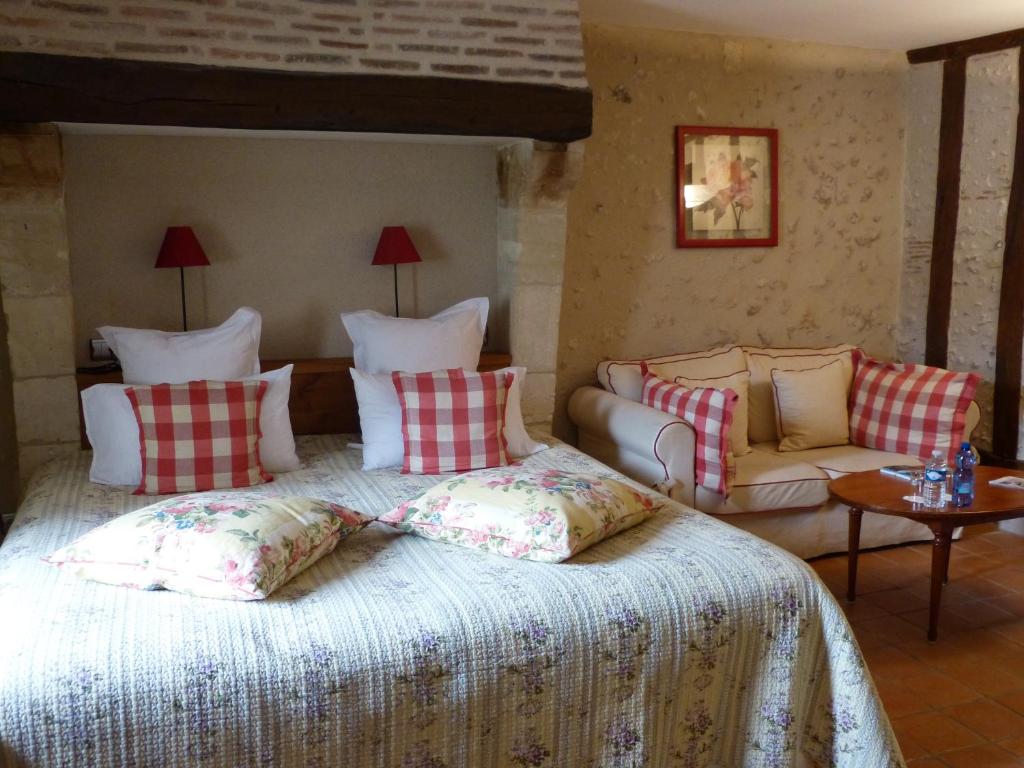 Postel nebo postele na pokoji v ubytování L'Aubinière Hôtel Restaurant & Spa