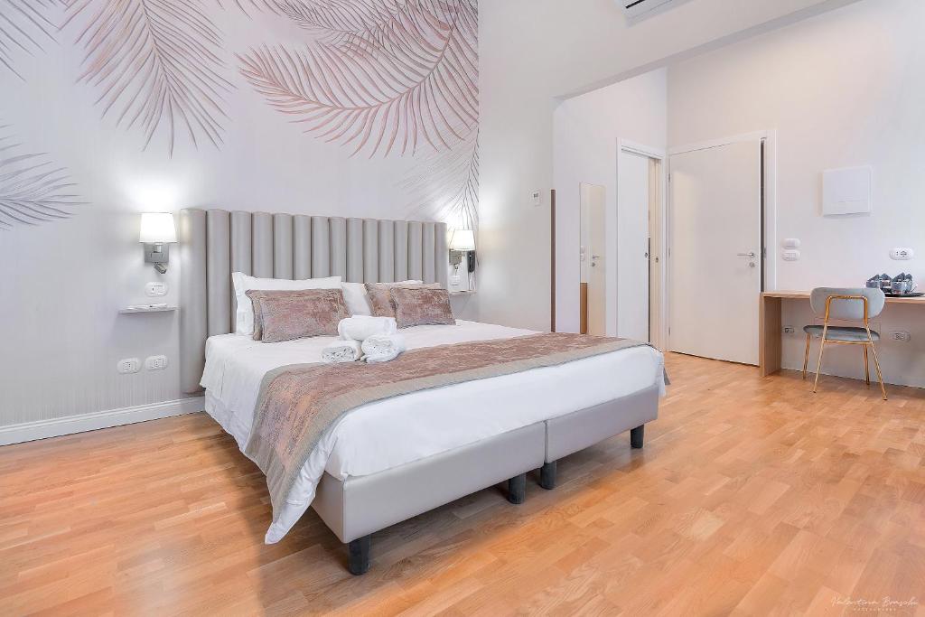 Postel nebo postele na pokoji v ubytování Hotel Cosmos