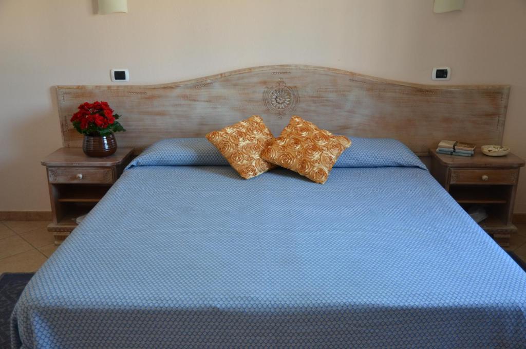 Łóżko lub łóżka w pokoju w obiekcie Hotel Delle Isole