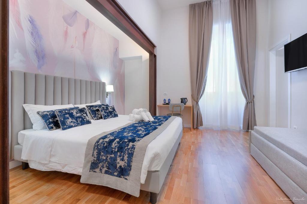 Postel nebo postele na pokoji v ubytování Hotel Cosmos