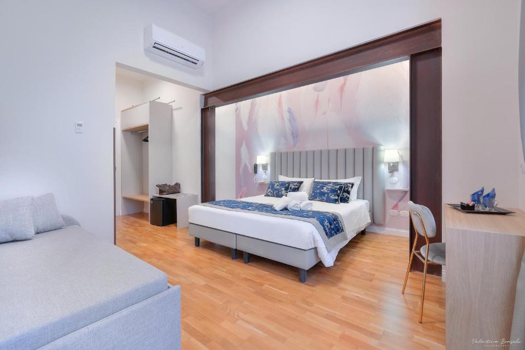 Postel nebo postele na pokoji v ubytování Hotel Cosmos
