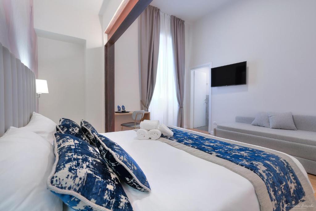 Postel nebo postele na pokoji v ubytování Hotel Cosmos