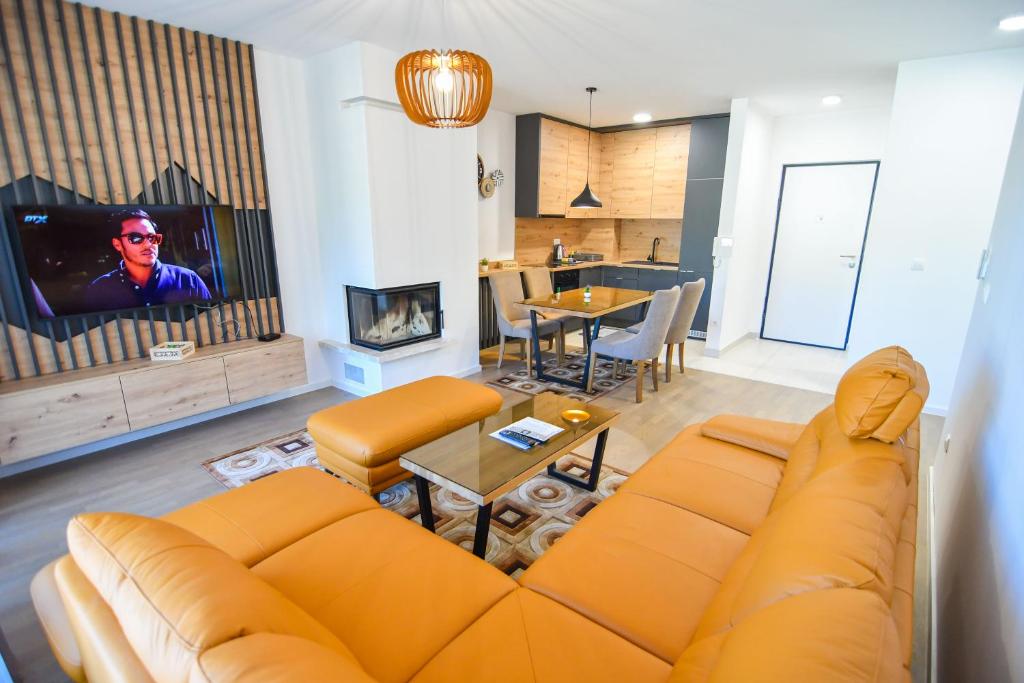 Μια τηλεόραση ή/και κέντρο ψυχαγωγίας στο Mountain Wings Apartments
