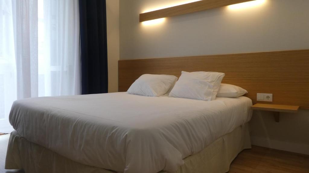 Cama o camas de una habitación en Plaza Pombo B&B - Hostal