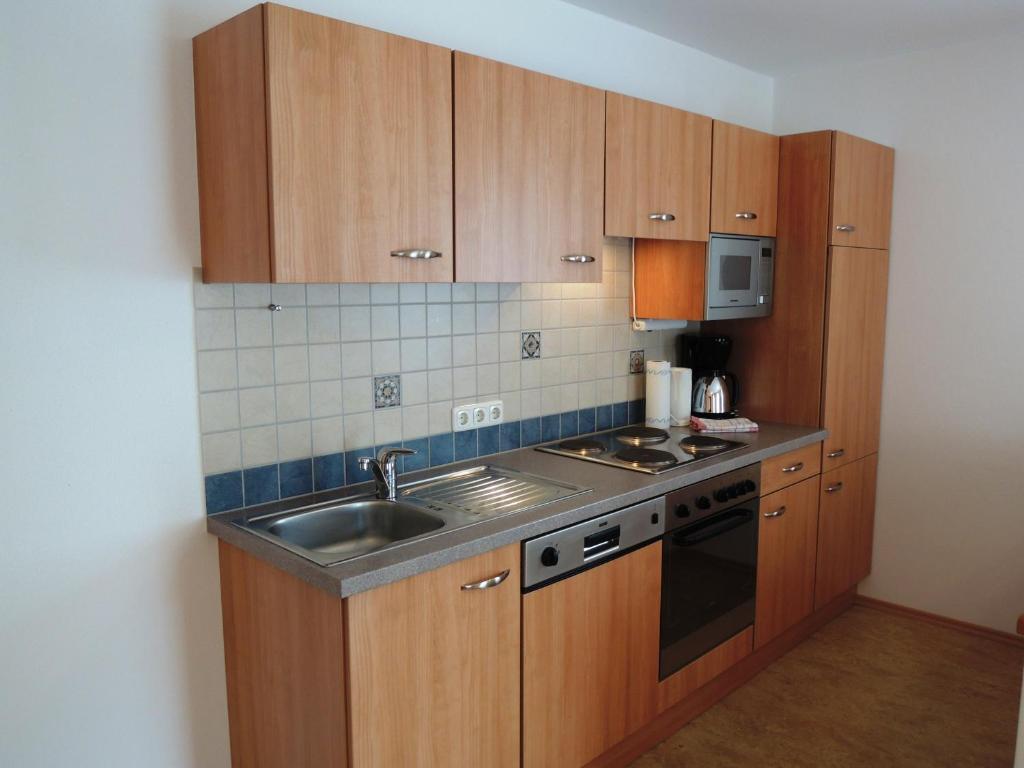 Kuchyň nebo kuchyňský kout v ubytování Appartements Edda