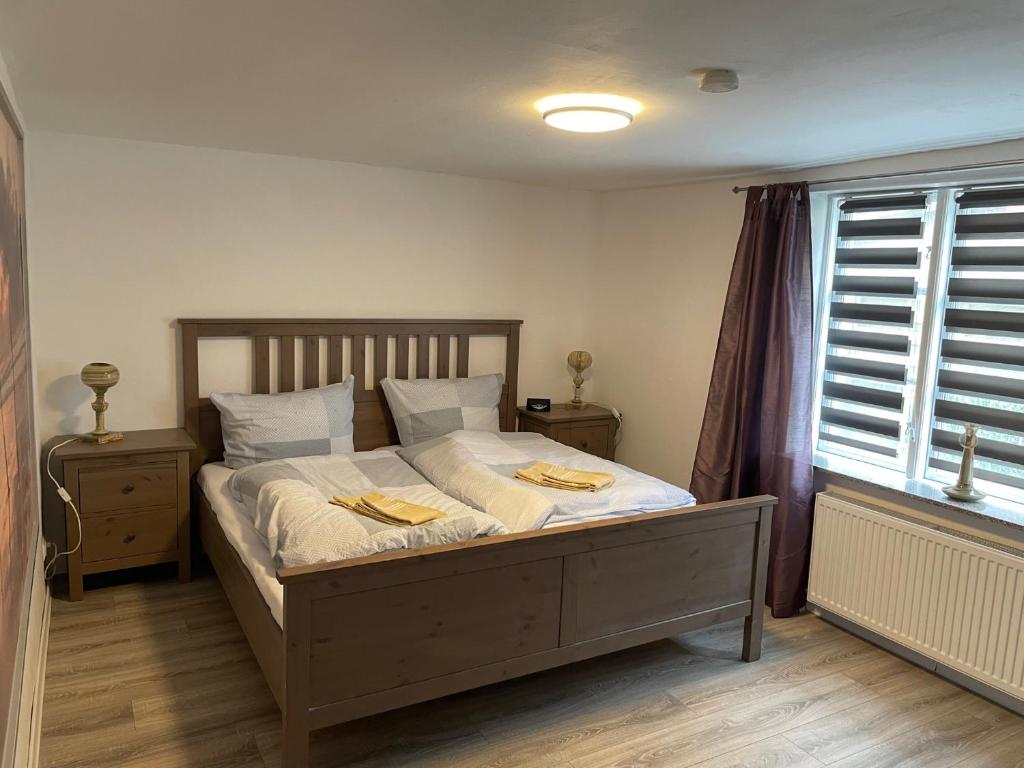 a bedroom with a bed with two towels on it at Ferienapartment Stemmert in Gelting