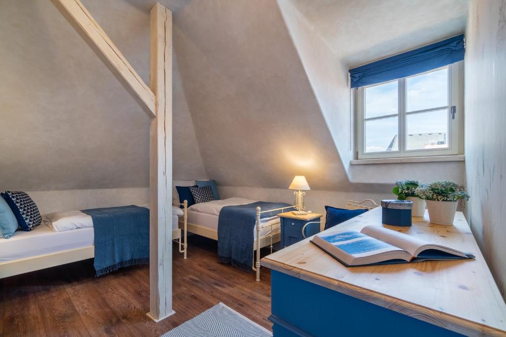 Postel nebo postele na pokoji v ubytování Boutique hotel Soukeníkův dům