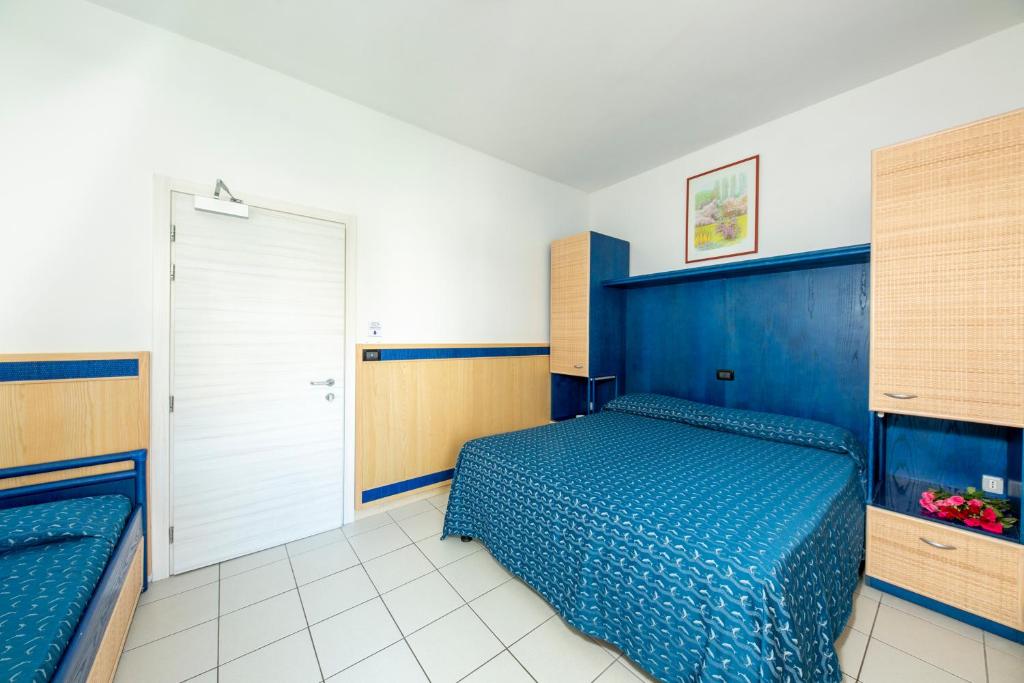 Postel nebo postele na pokoji v ubytování Hotel Olanda