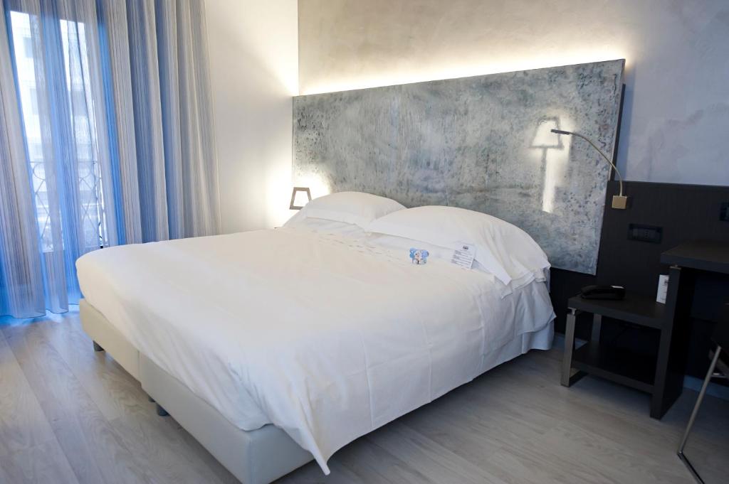 Postel nebo postele na pokoji v ubytování Arli Hotel Business and Wellness