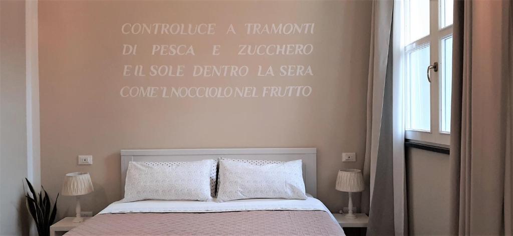 Łóżko lub łóżka w pokoju w obiekcie Amandolevanto B&B