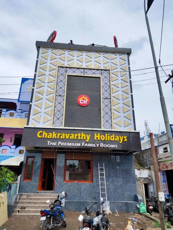 a restaurant with motorcycles parked in front of it at Chakravarthy Holidays in Kanchipuram