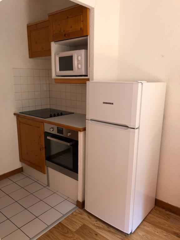 Kuchyň nebo kuchyňský kout v ubytování Résidence Saboia B32 Clés Blanches Courchevel