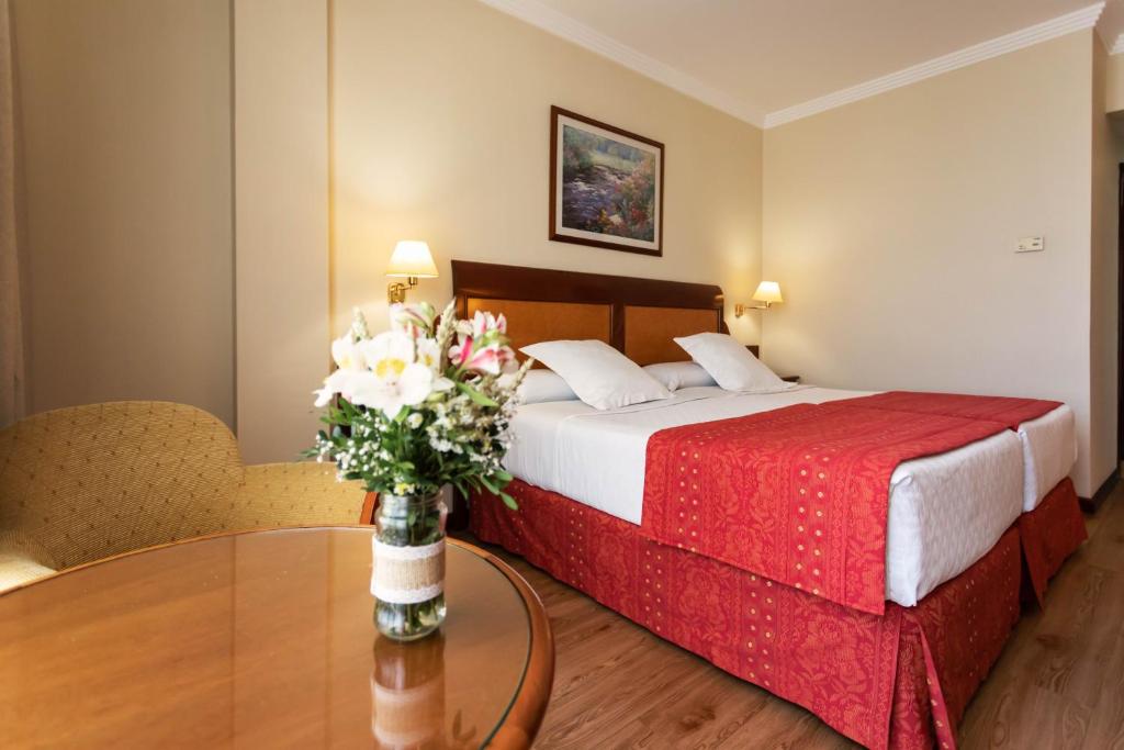 Posteľ alebo postele v izbe v ubytovaní Gran Hotel de Ferrol