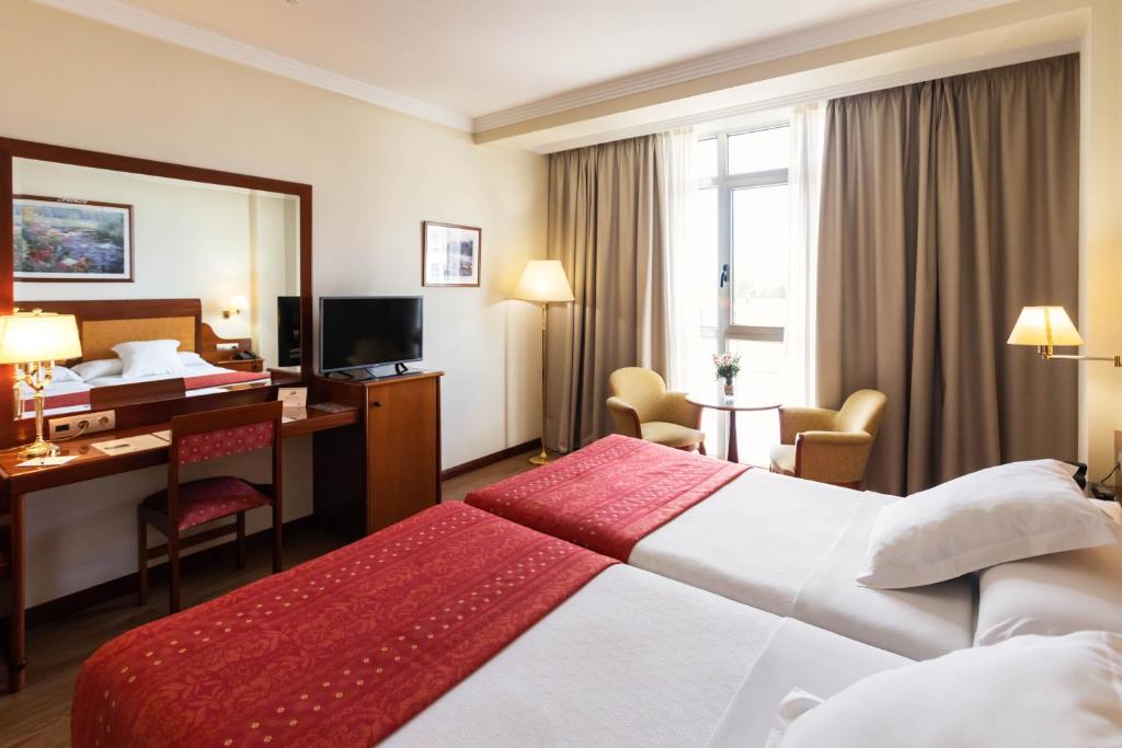 Posteľ alebo postele v izbe v ubytovaní Gran Hotel de Ferrol