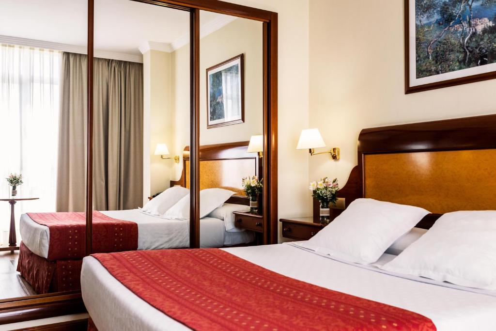 Posteľ alebo postele v izbe v ubytovaní Gran Hotel de Ferrol