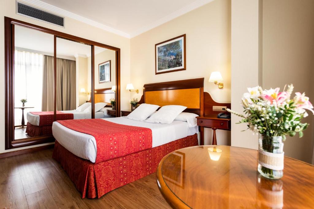 Posteľ alebo postele v izbe v ubytovaní Gran Hotel de Ferrol