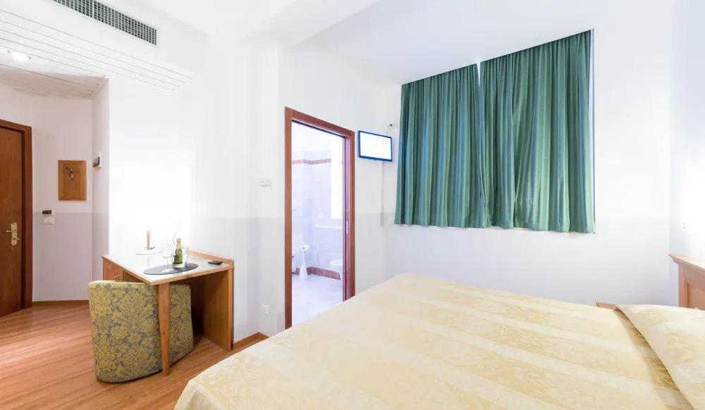 Postel nebo postele na pokoji v ubytování LAERTE PALACE HOTEL