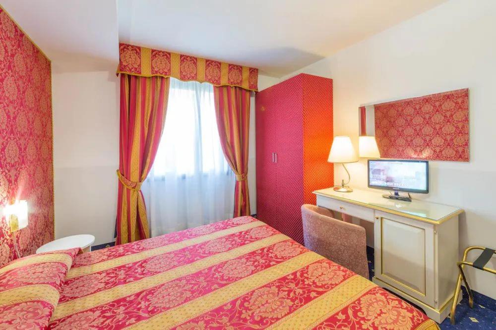 Postel nebo postele na pokoji v ubytování LAERTE PALACE HOTEL