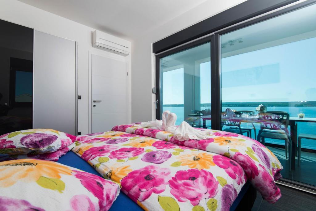 Postel nebo postele na pokoji v ubytování Design-Beachresort