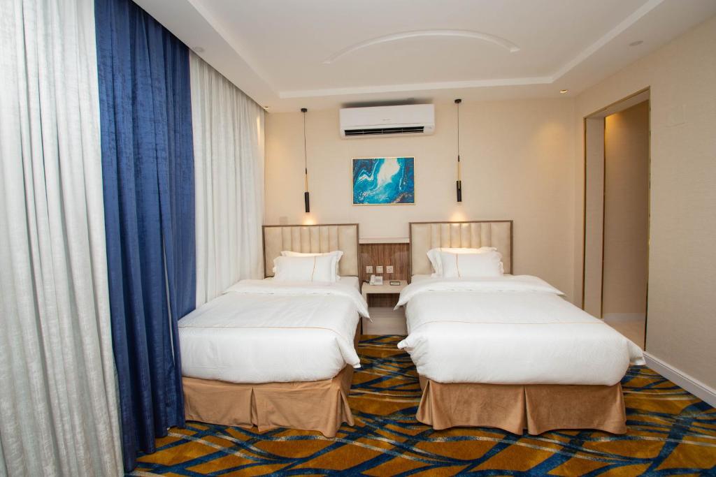 Postel nebo postele na pokoji v ubytování فندق قوبا السويس - Quba Swess Hotel Jazan