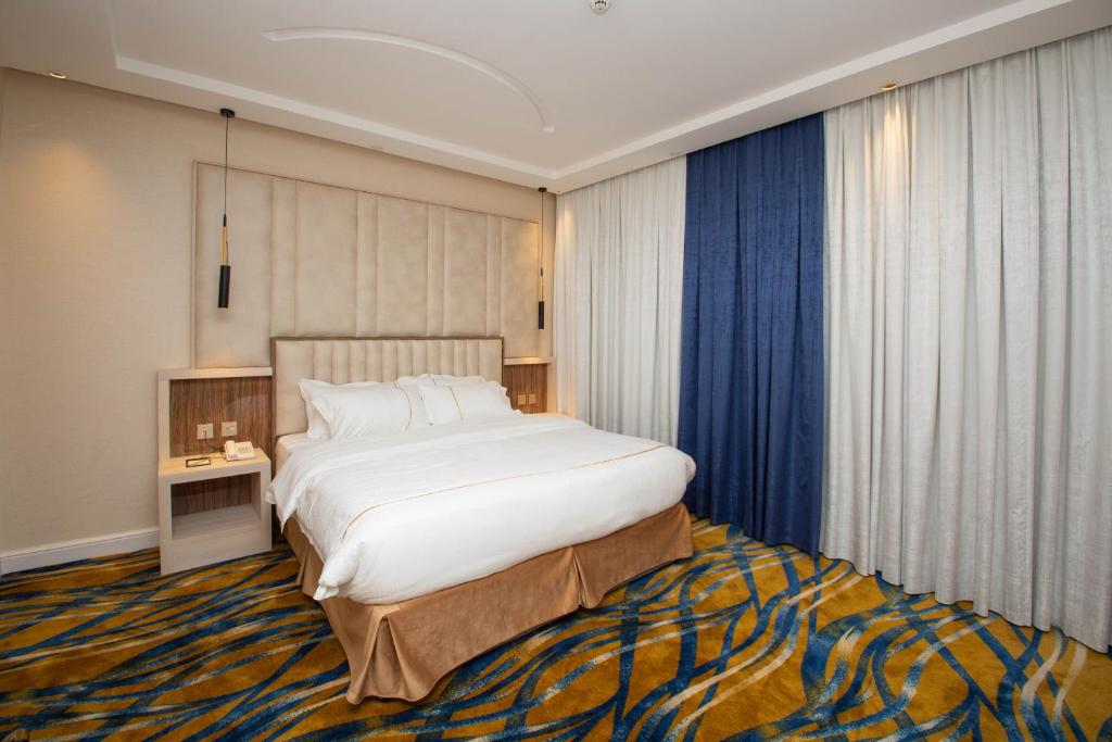 Postel nebo postele na pokoji v ubytování فندق قوبا السويس - Quba Swess Hotel Jazan
