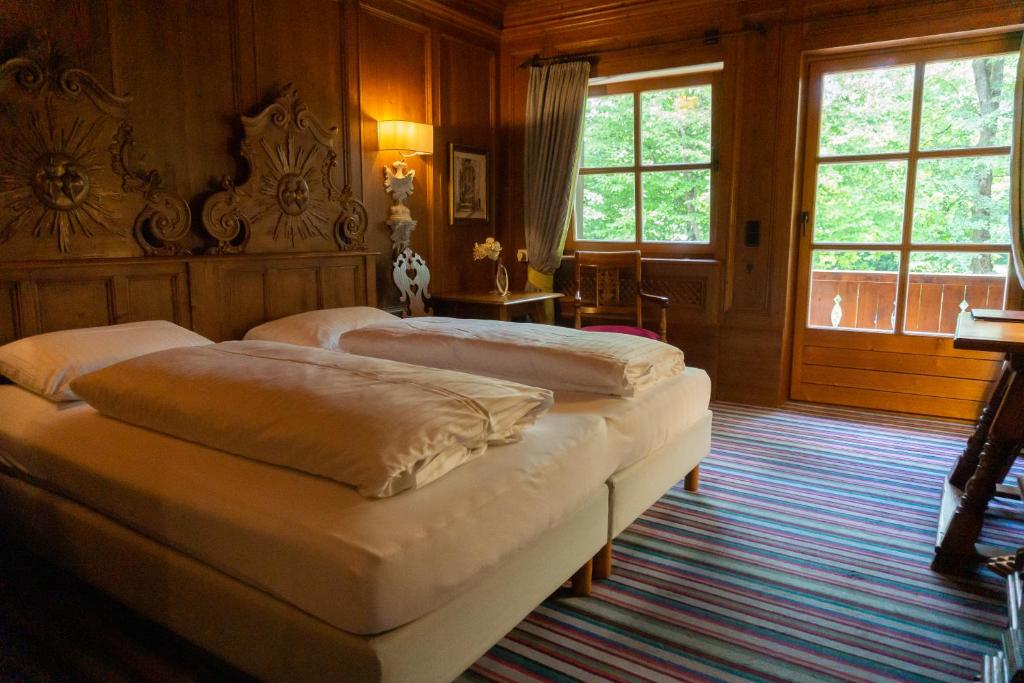 Postel nebo postele na pokoji v ubytování Hotel Schrenkhof