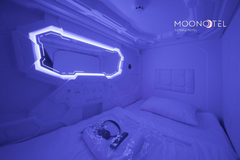 Postel nebo postele na pokoji v ubytování MOONOTEL Maidan