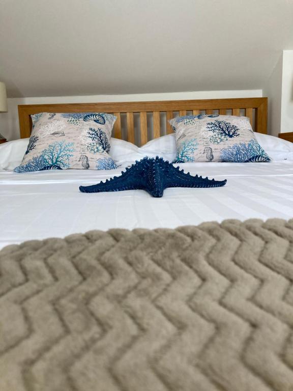 a close up of a bed with two pillows at Trogir, Villa Salena, Residenz Ciovo Pearl, Slatine, Island Ciovo, Split in Slatine