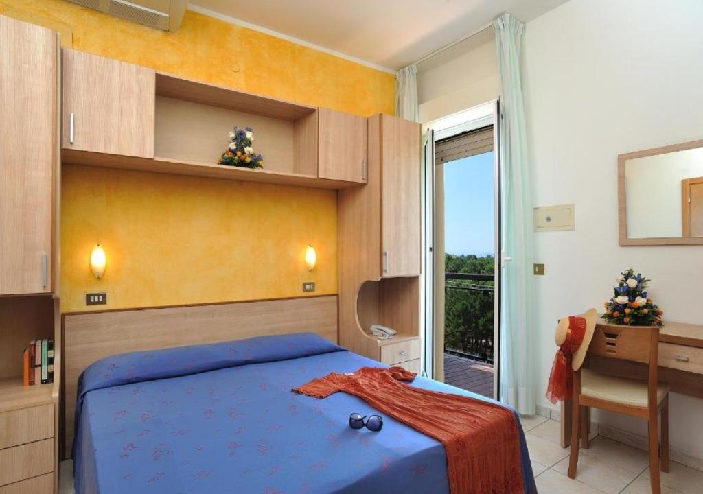 Postel nebo postele na pokoji v ubytování Hotel Ausonia