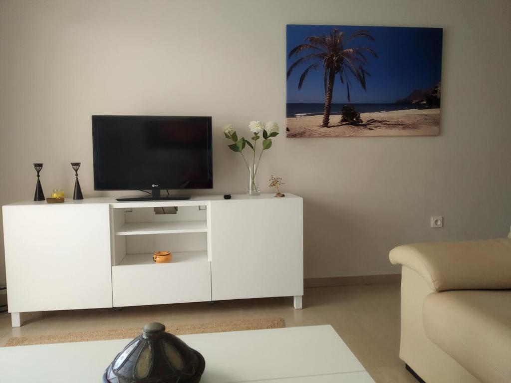 TV a/nebo společenská místnost v ubytování Sotavento 1ª línea de playa
