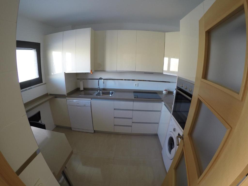 Kuchyň nebo kuchyňský kout v ubytování Sotavento 1ª línea de playa