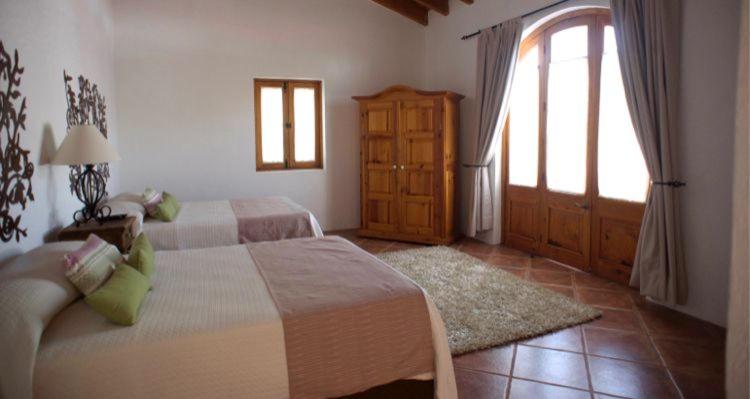 Postel nebo postele na pokoji v ubytování La Casona de los Colibríes