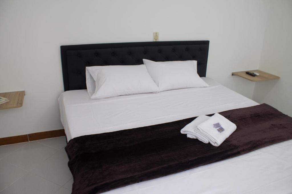 Postel nebo postele na pokoji v ubytování Hotel Picasso 70