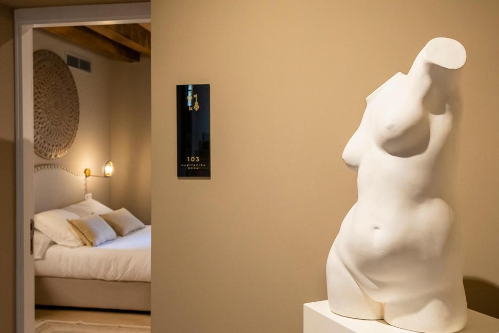 Posteľ alebo postele v izbe v ubytovaní Hotel Palacio De Luko