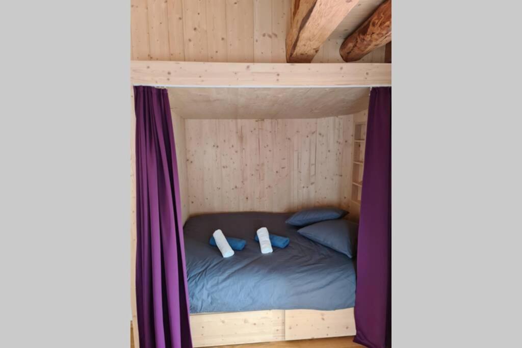 Postel nebo postele na pokoji v ubytování Petit bijou de Sainte-Croix