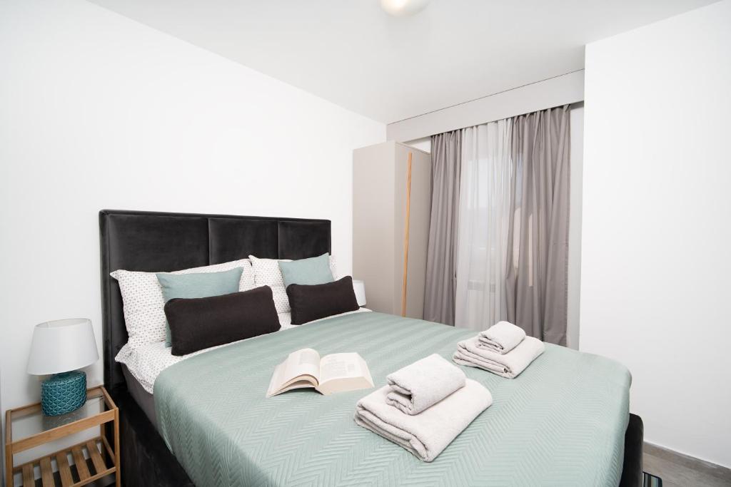 Postel nebo postele na pokoji v ubytování Apartments Palma Rabac