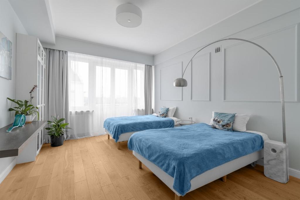 Unit Apartment Deluxe Warszawa Centrum Plac Zbawiciela Hala Koszykiにあるベッド