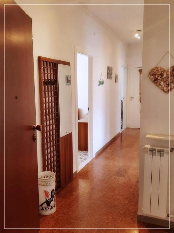 a room with a hallway with a heart hanging on the wall at La casa di Palma in Alassio