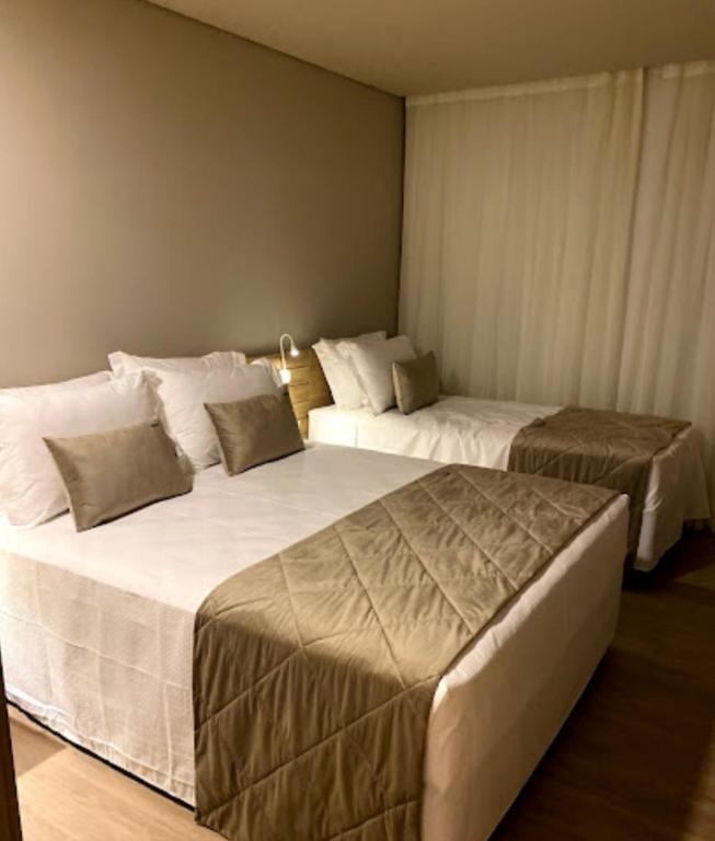 Postel nebo postele na pokoji v ubytování Laghetto Resort Golden Gramado