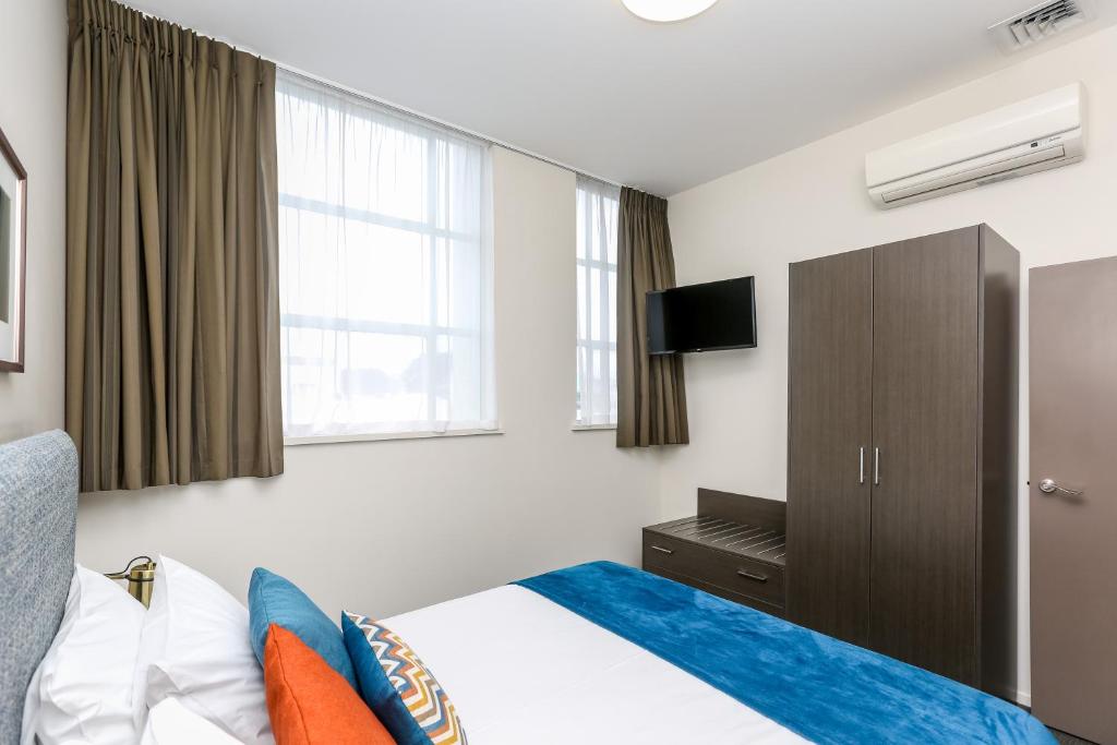 Voodi või voodid majutusasutuse Quest New Plymouth Apartment Hotel toas