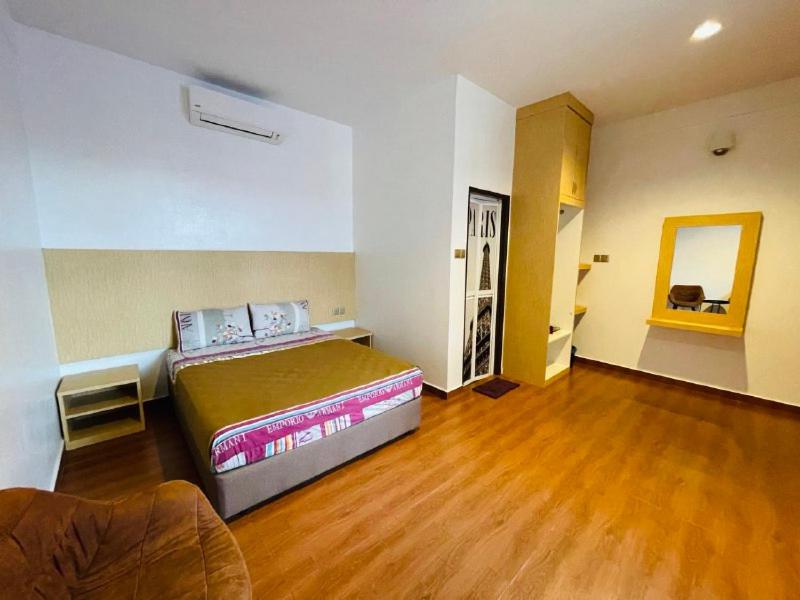 Postel nebo postele na pokoji v ubytování Dz Residence Tunjong