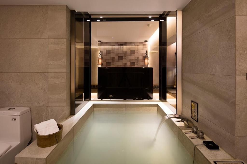 Koupelna v ubytování JBG Hotspring Resort Hotel