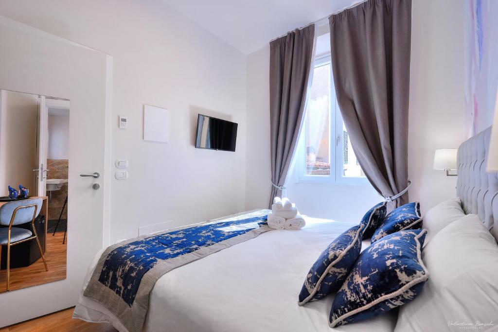Postel nebo postele na pokoji v ubytování Hotel Cosmos