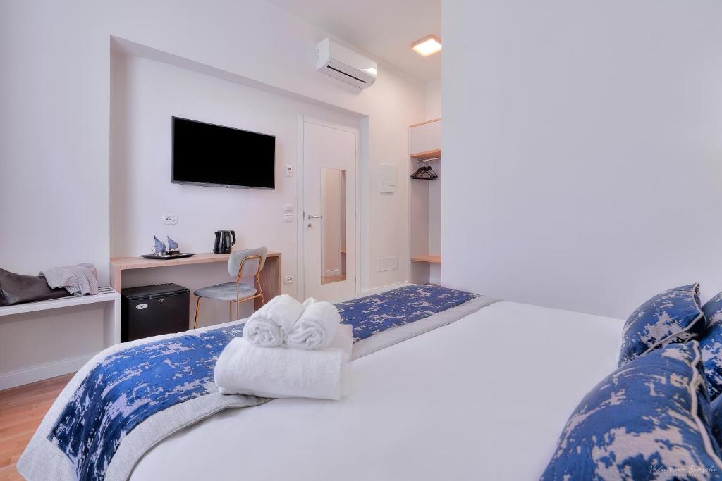 Postel nebo postele na pokoji v ubytování Hotel Cosmos